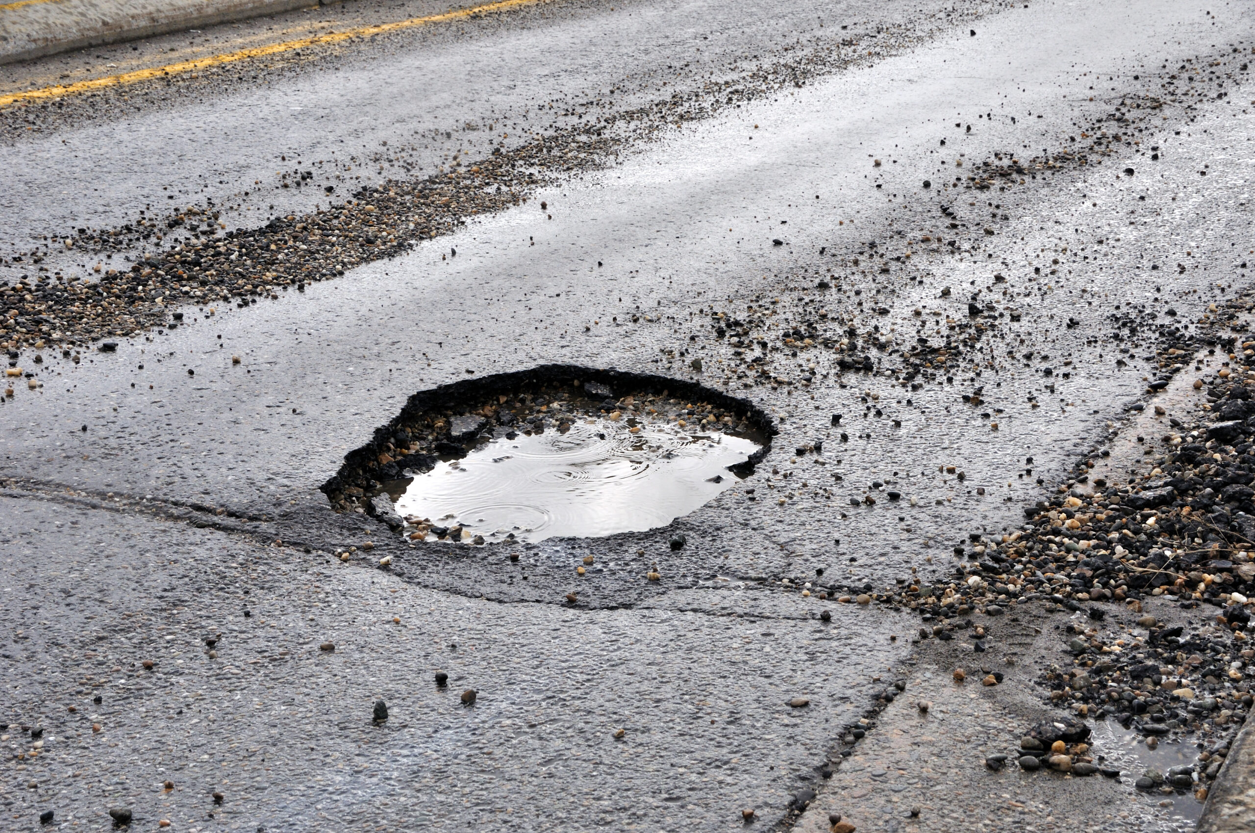 Road damage caused by heavy vehicles